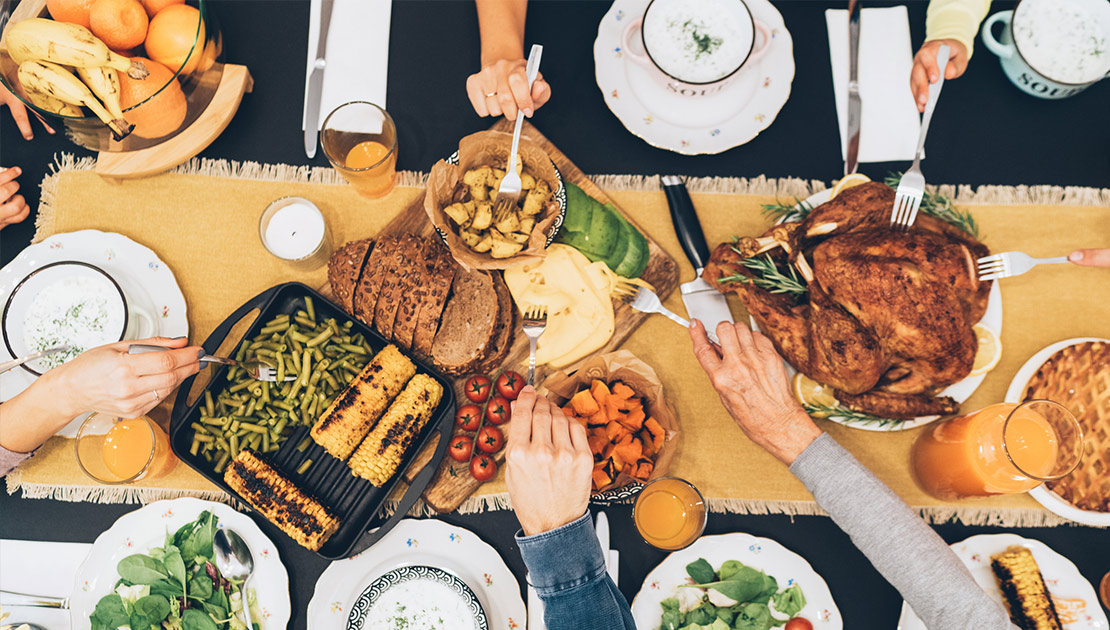 birds eye view of a thanksgiving dinner table filled with food