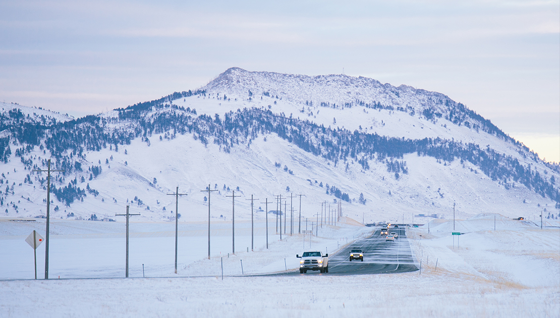 vehicles driving down a wintery US 12 near Helena