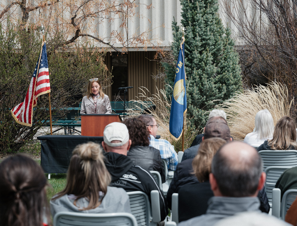 Melissa Dyekman, widow of late MDT employee Jeff Dyekman, presents to a group gathered for the MDT Employee Memorial dedication