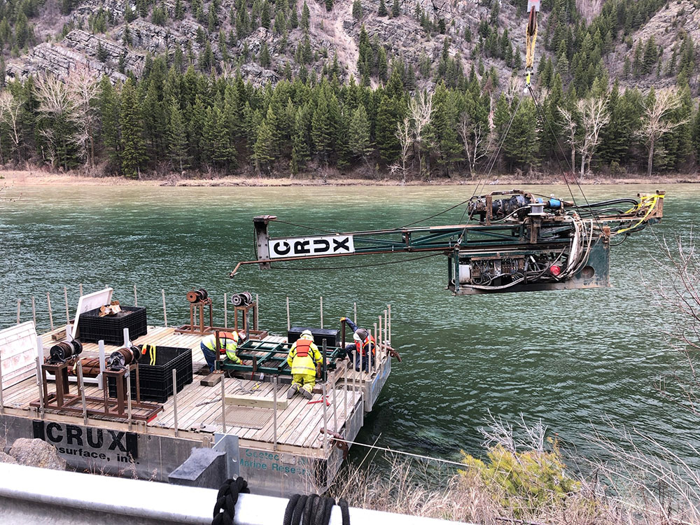 Construction material is lifted over the Flathead River in Bad Rock Canyon Image