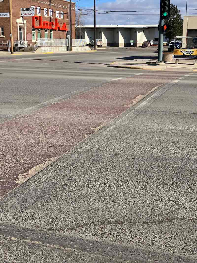 Photo showing concrete panels and crosswalks at the intersection of 19th Avenue and 1st Street West, which MDT will repair during the project. 