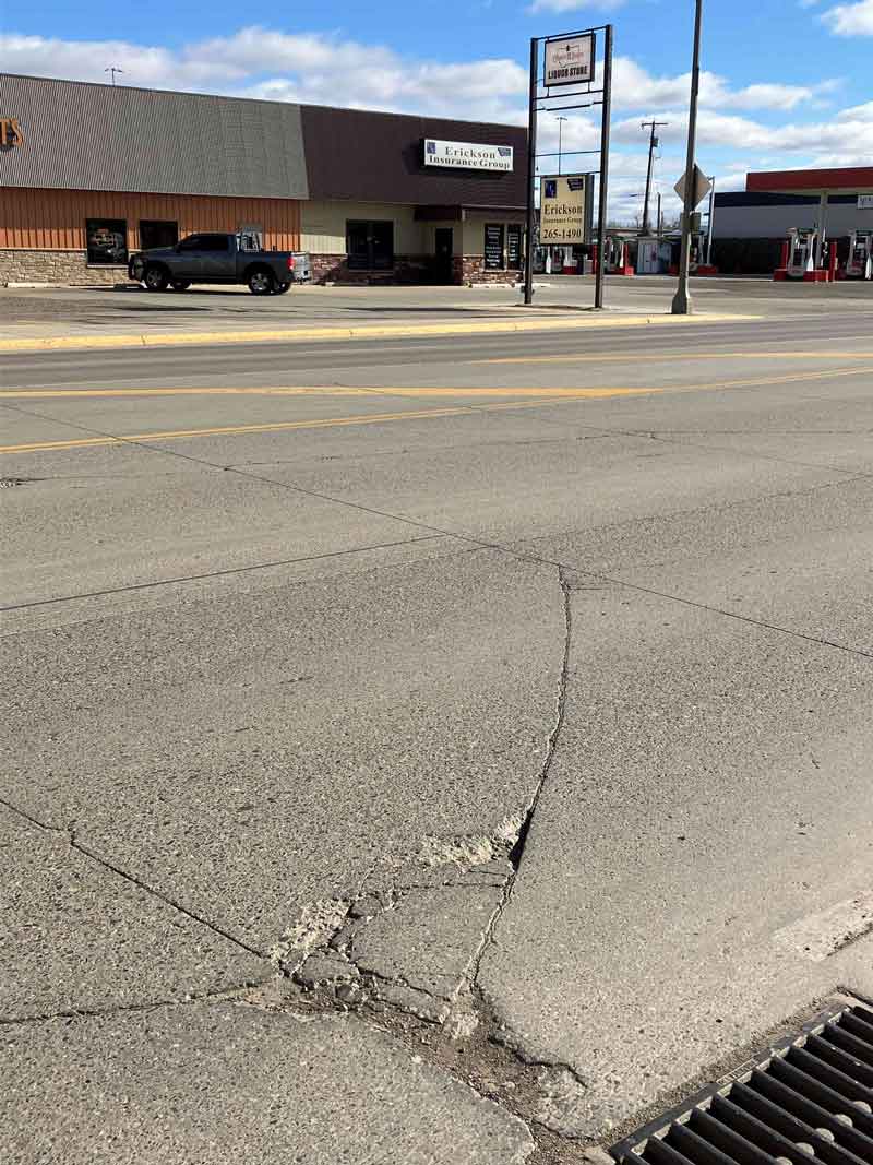 Photo showing cracked and damaged concrete pavement panels in the roadway, which MDT will repair or replace as part of the project.