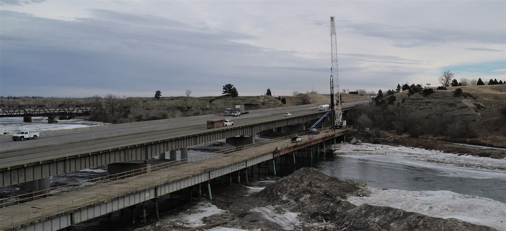 The temporary work bridge is near completion and will be used to construct the new eastbound I 90 bridge.