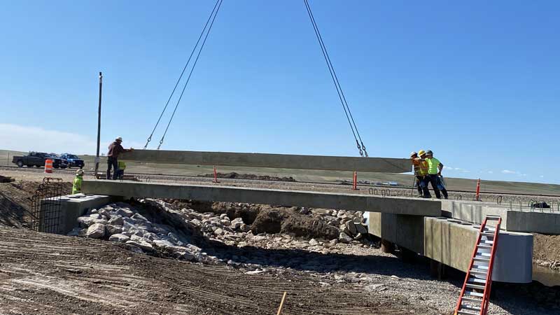 The panel is set into place at the bridge construction site.