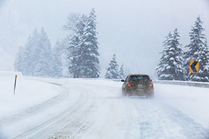 car on icy road image