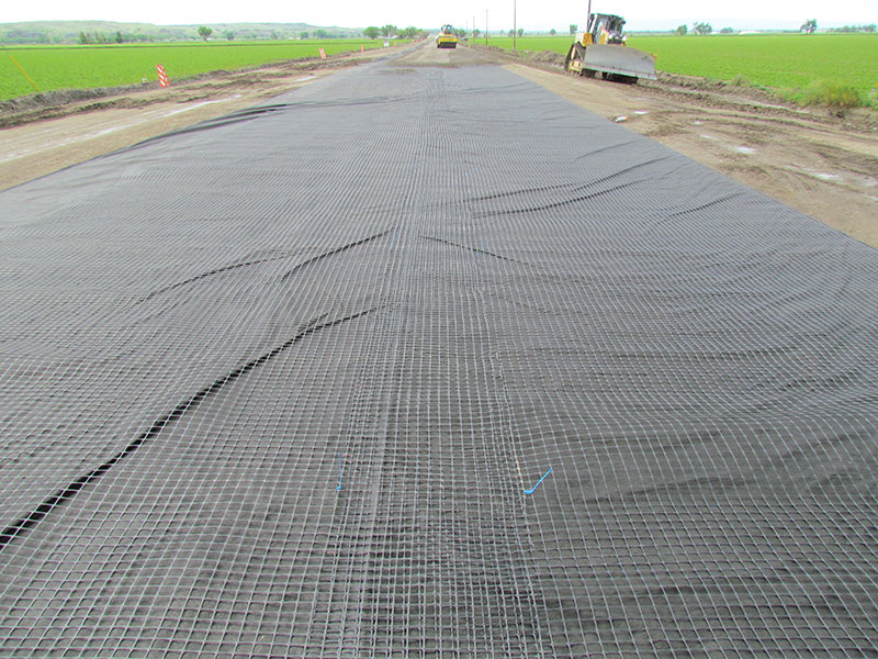 Gravel base of roadway with Tenax structural geogrid and fiber