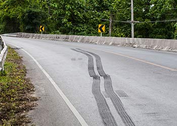 skidmarks on a corner of highway